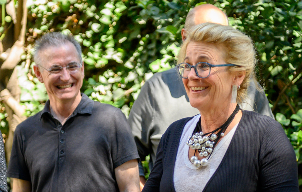 Learners sharing laughter and conversation during a group activity at the Spanish immersion in Mexico City, part of the Fluenz personalized experience.