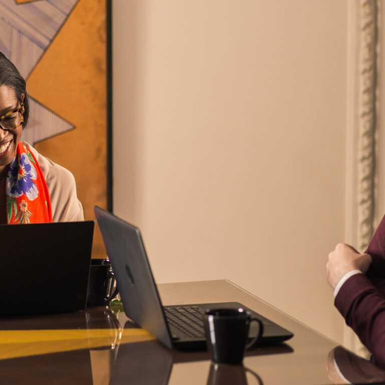 Learner and Spanish tutor engaged in a lively one-on-one session at the Fluenz Spanish Bootcamp in Mexico City, part of the immersive program designed to help adults achieve real fluency through personalized instruction.