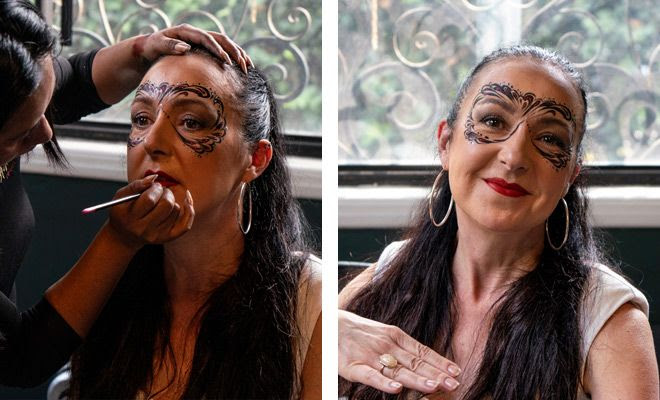 A participant at the Fluenz Spanish Immersion in Mexico City getting her face painted for Día de Muertos celebrations, part of the best Spanish program in Mexico designed for adult learners seeking a deep cultural and linguistic experience.