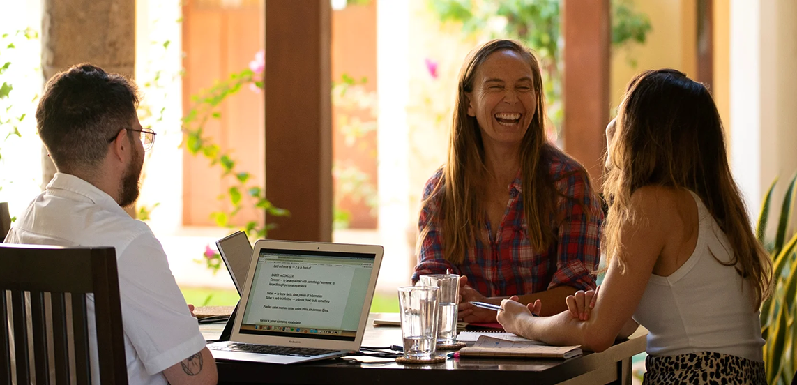 Spanish tutors and students working together at the Fluenz Spanish Immersion in Mexico City, the best and most effective program to learn Spanish in Mexico. The image captures the personalized coaching, engaging conversation, and adult-focused approach that define the most respected Spanish immersion experience in Mexico City.