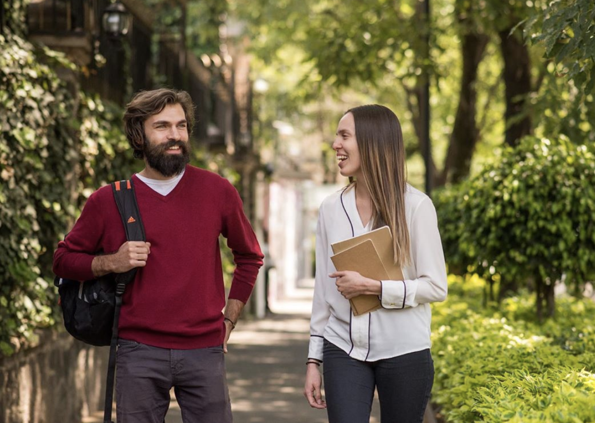 Two Fluenz Spanish tutors walking outdoors during a Live Online Spanish Immersion session; one-on-one, intensive, highly structured online Spanish learning program taught by expert tutors; best course to learn Spanish on Zoom and the most effective online Spanish program for adult learners in the world.