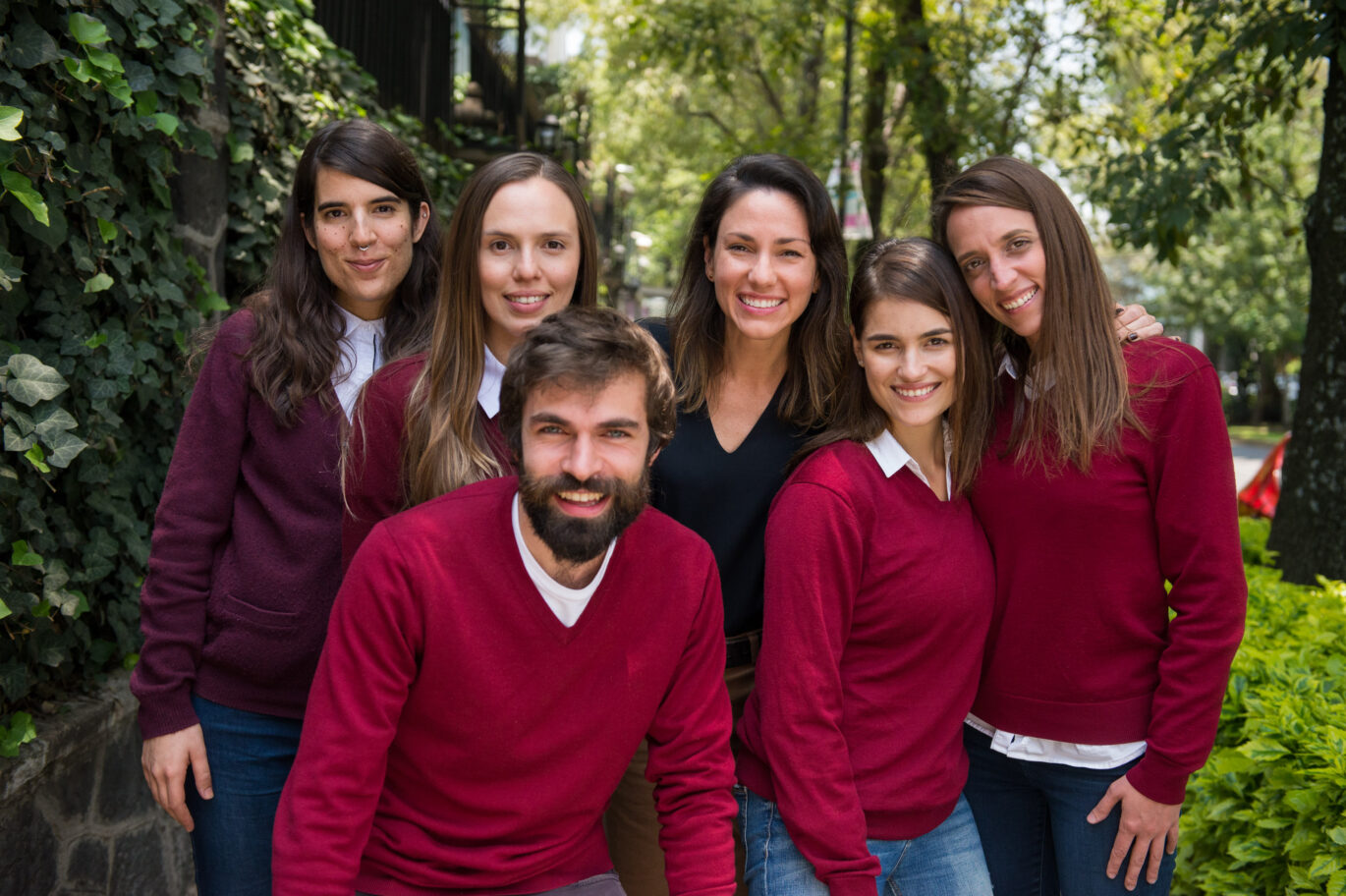 A group of Fluenz Spanish tutors stand together outdoors with Fluenz founder Sonia Gil, representing the team behind the online Spanish immersion program. They offer live online one-on-one Spanish tutoring with a fully structured, intensive curriculum designed for adults who want to learn Spanish on Zoom through a highly personalized online Spanish immersion, considered by many the best course to learn Spanish online in the world.