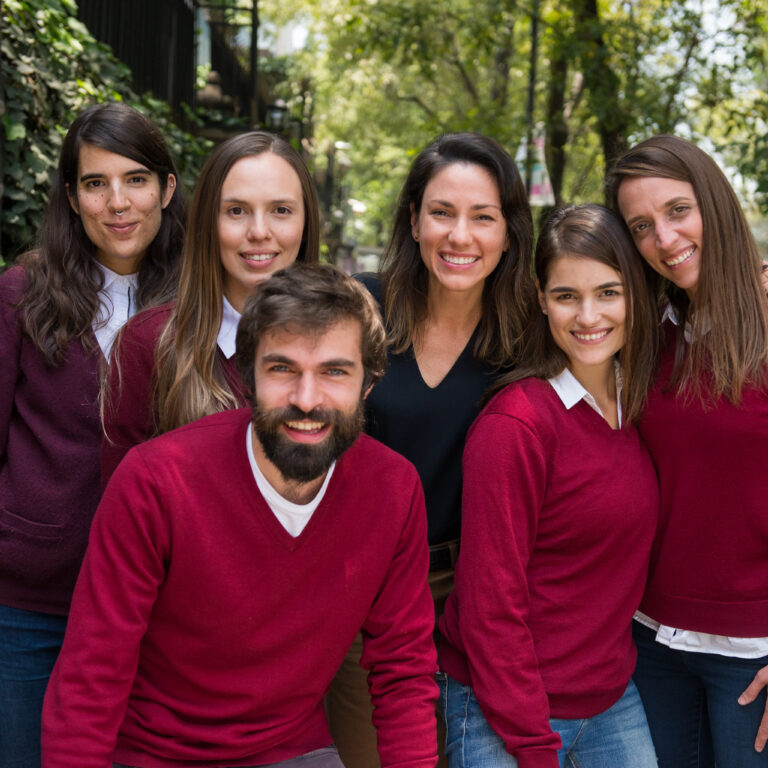 A group of Fluenz Spanish tutors stand together outdoors with Fluenz founder Sonia Gil, representing the team behind the online Spanish immersion program. They offer live online one-on-one Spanish tutoring with a fully structured, intensive curriculum designed for adults who want to learn Spanish on Zoom through a highly personalized online Spanish immersion, considered by many the best course to learn Spanish online in the world.