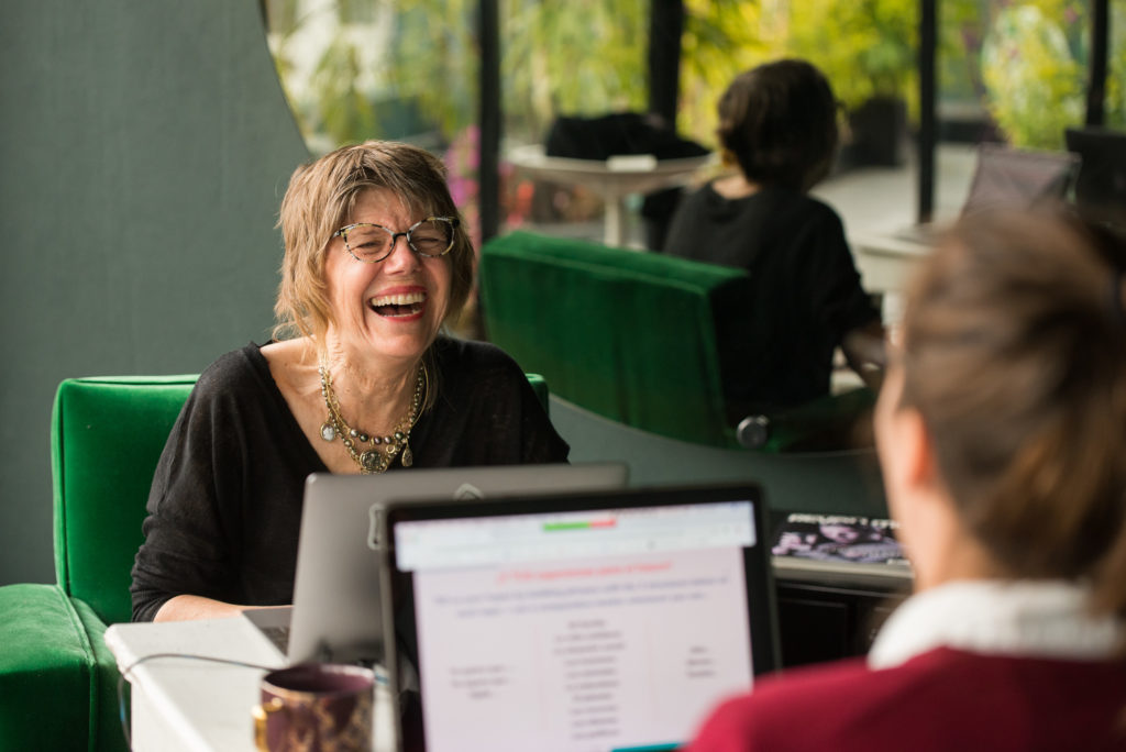 Fluenz Spanish immersion in Mexico City with adult learner and Spanish tutor in one-on-one instruction, studying Spanish on a laptop during an intensive, structured immersion experience that combines language education with real cultural engagement in Mexico City.