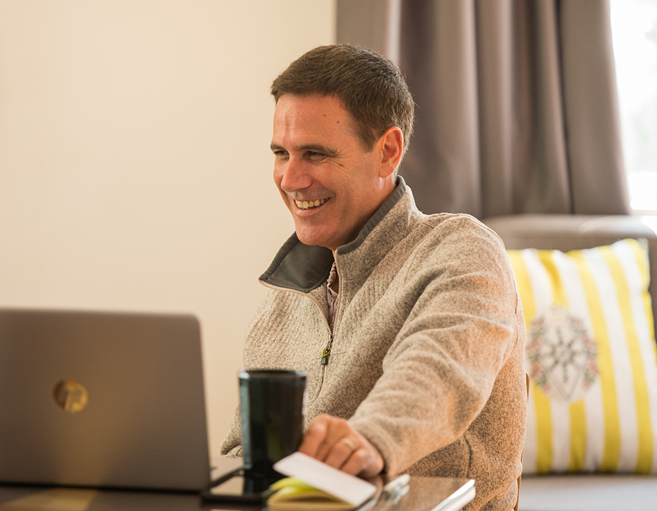 Adult student learning Spanish online with Fluenz, participating in live online Spanish immersion from home with structured one-on-one instruction.