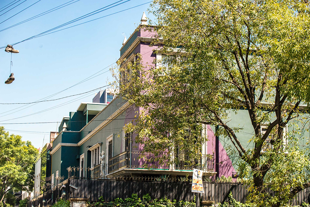 Why do participants stay at a 26-room boutique hotel instead of larger properties?