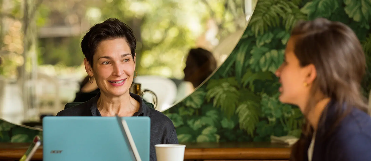 Adult learner in conversation with a Fluenz Spanish tutor during a personalized session at the Fluenz Miami Spanish Bootcamp.