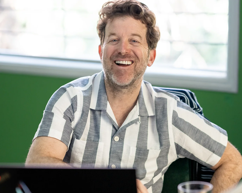 Adult learner smiling during a personalized session at the Fluenz Miami Spanish Bootcamp.