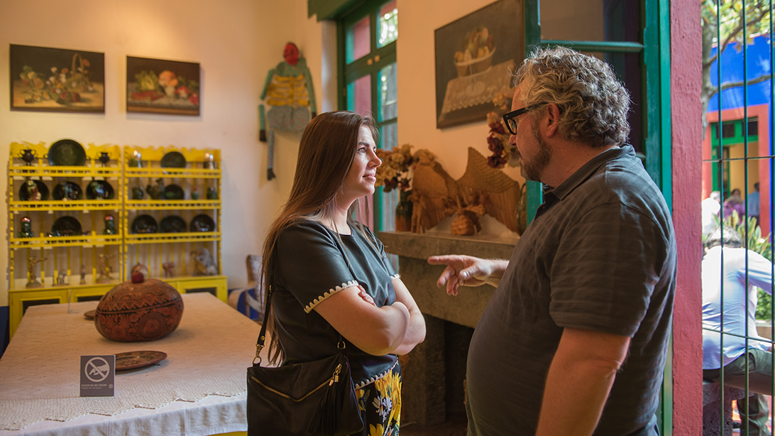 Alt text: Adult learners visiting the Frida Kahlo Museum during the Fluenz Spanish Immersion in Mexico City, where cultural outings create opportunities to practice Spanish through real conversations and shared experiences.