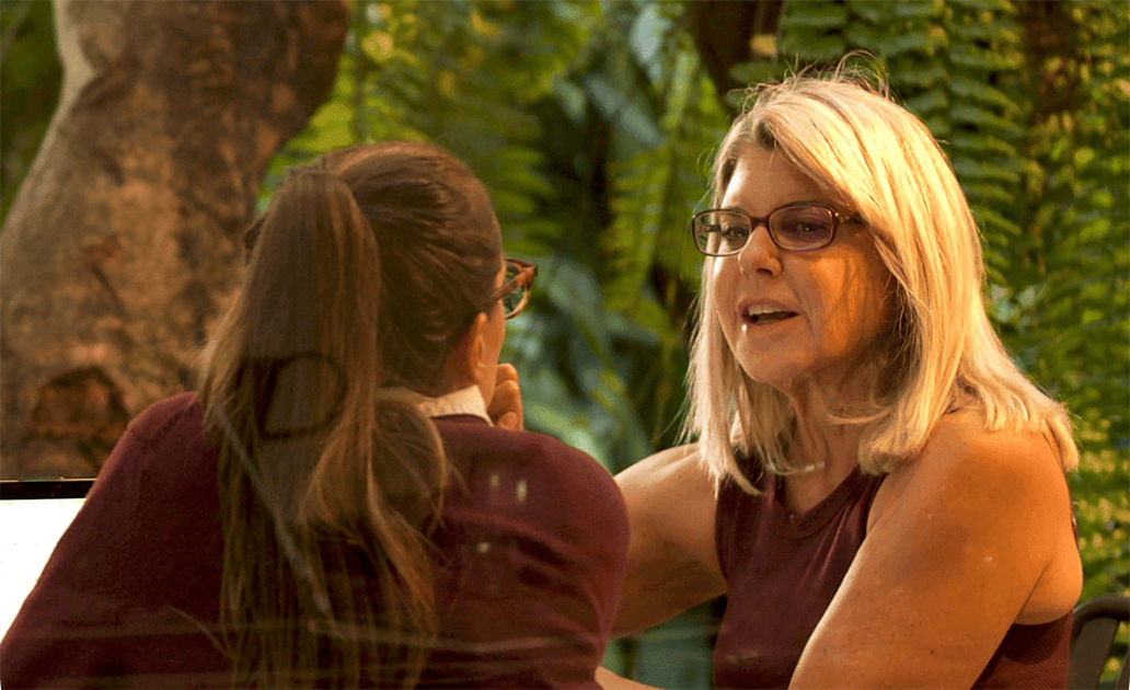 Fluenz Spanish Bootcamp participant practices Spanish face-to-face with a tutor.