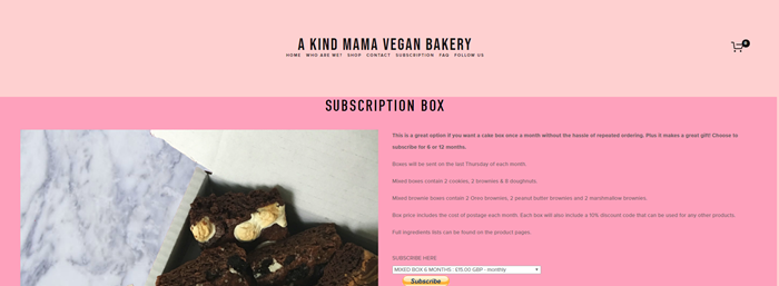 A Kind Mama Bakery website screenshot showing a two-tone pink background, with brownie photos and details about the box.