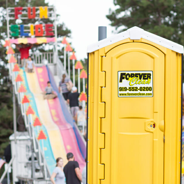 forever clean portable restroom in front of fair slide forever clean portable restroom in front of fair slide