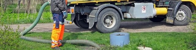 septic services with long pipe in yard truck septic services with long pipe in yard truck
