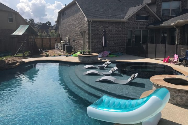 Houston custom pool design highlighting features added during the build timeline