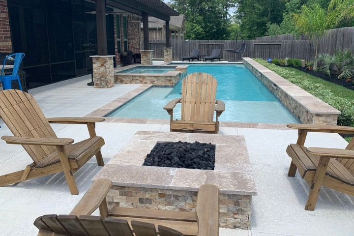 Functional pool placement with lounge chairs and fire pit