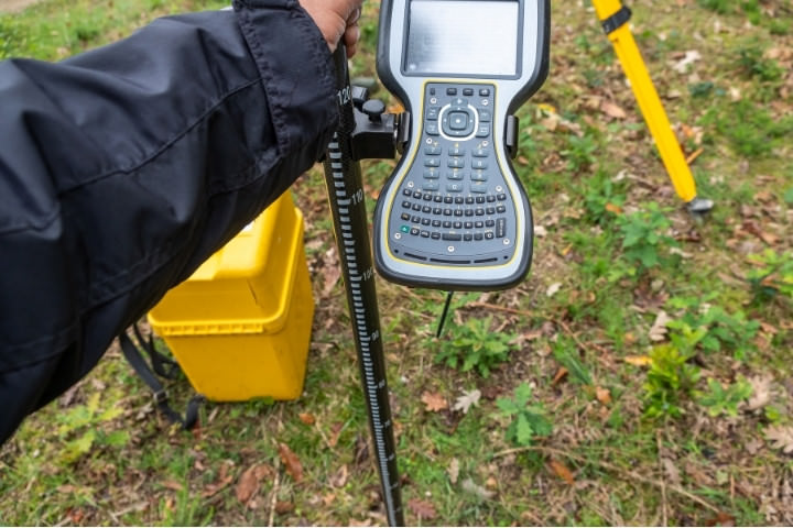 Survey equipment measuring lot for pool layout