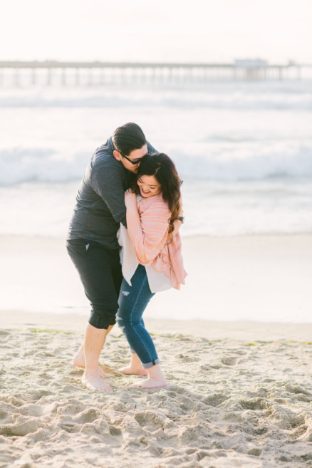 Cuddling on the Ocean Beach Shoreline – Photo by Let's Frolic Together