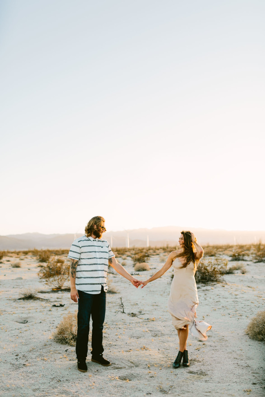 A Windy, Romantic Desert Engagement – Photo by Let's Frolic Together