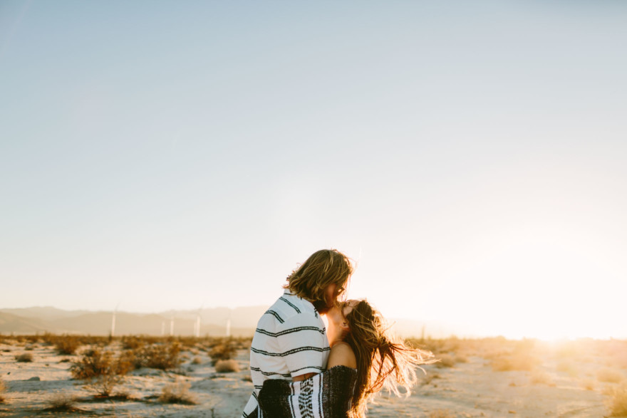 A Windy, Romantic Desert Engagement – Photo by Let's Frolic Together