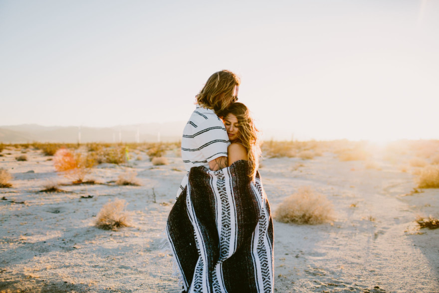 A Windy, Romantic Desert Engagement – Photo by Let's Frolic Together