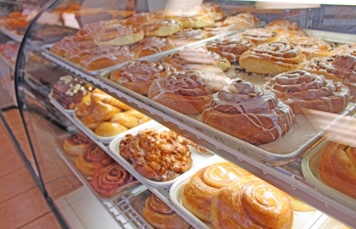 The second case holds an impressive selection of cinnamon rolls, apple fritters and specialty donuts including a peanut butter-filled one.