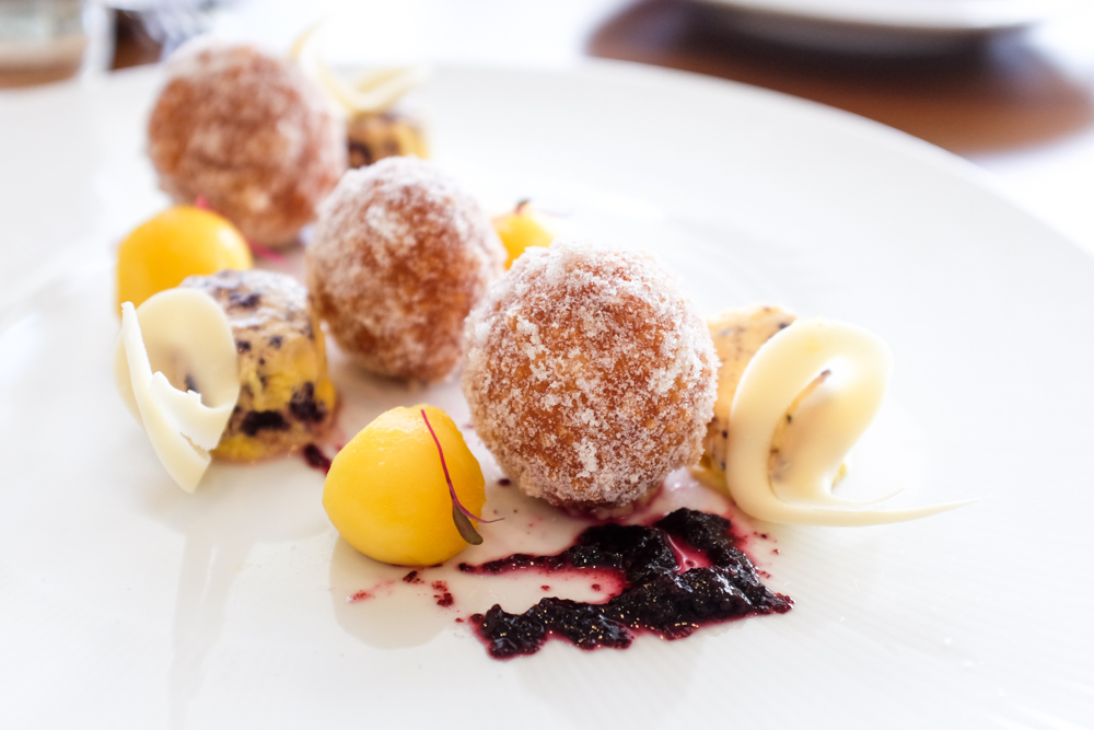 The mango malasadas ($12) came recommended by our server and were perhaps my favorite item. They're served with a mango-blueberry semifreddo, blueberry coulis and tart balls of chilled mango.