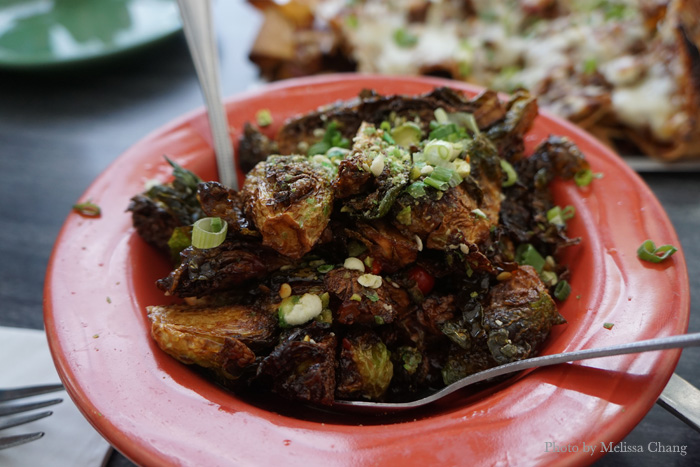 Sweet and spicy brussels sprouts, $7.99. If you like brussels sprouts, this one is a winner! They're tossed with butter, sambal, local maple syrup, lime juice, Sweetie Drop peppers, green onions and — get this — crushed wasabi peas. Someone make this in Hawaii!
