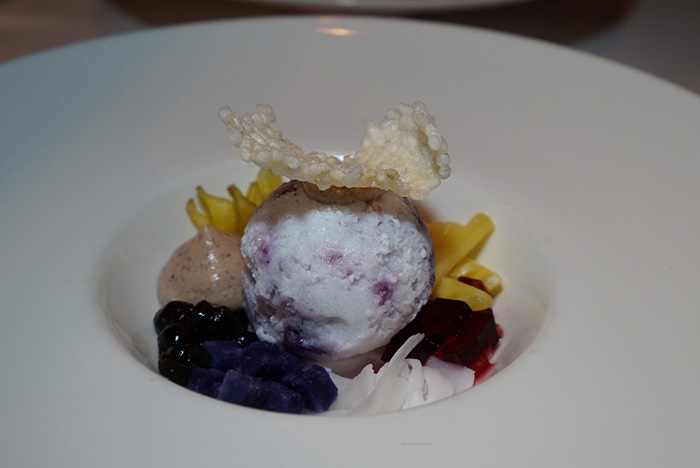 Hallo, halohalo! Jose's flair as a pastry chef is shown here with this ball of coconut shaved ice surrounded by homemade accompaniments: ube jam, azuki bean mousse and hibiscus gelee. Okay, the tapioca pearls aren't quite homemade, but they're necessary. It's topped with a crispy rice wafer for added taste and texture. After taking a photo of this, mix it all together so you get a little bit of everything in each bite. So good! This is paired with Domaine Huet, 2015 Vouvray Moelleux from Loire Valley.