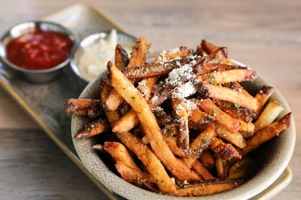 The garlic truffle hand cut fries ($8) are great to munch on with any of the 30+ craft beers on tap. $4 on happy hour.