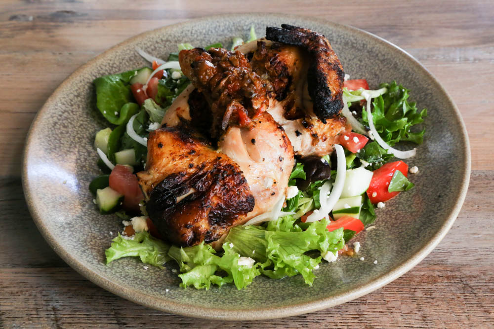The half rotisserie chicken is marinated in herbs and served on a bed of organic greens, vine ripened tomatoes, kalamata olives, feta and a mushroom tomato compote ($27). It's juicy and so flavorful that I couldn't stop picking at what was left.
