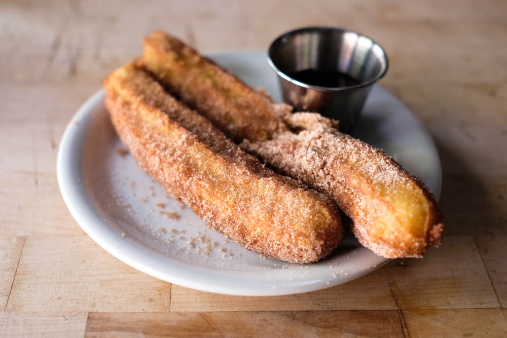Cinnamon fans will rejoice with fists of Encore Saloon's churros ($6), which come with a Mexican-chocolate sauce that's got some spice to it. The churro sticks are light and airy and are just what you want after a few tacos and some margaritas.