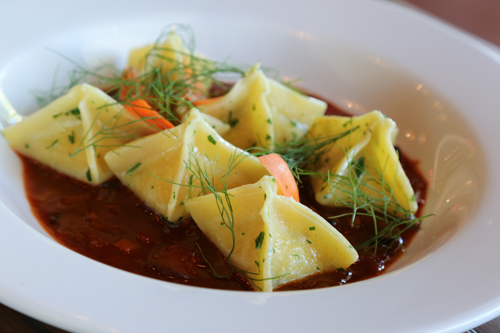 This is easily the best vegetarian dish I've eaten in a long time. The farmer's goulash contains potato and leek dumplings in a bright Hungarian style stew spiced with sweet paprika.