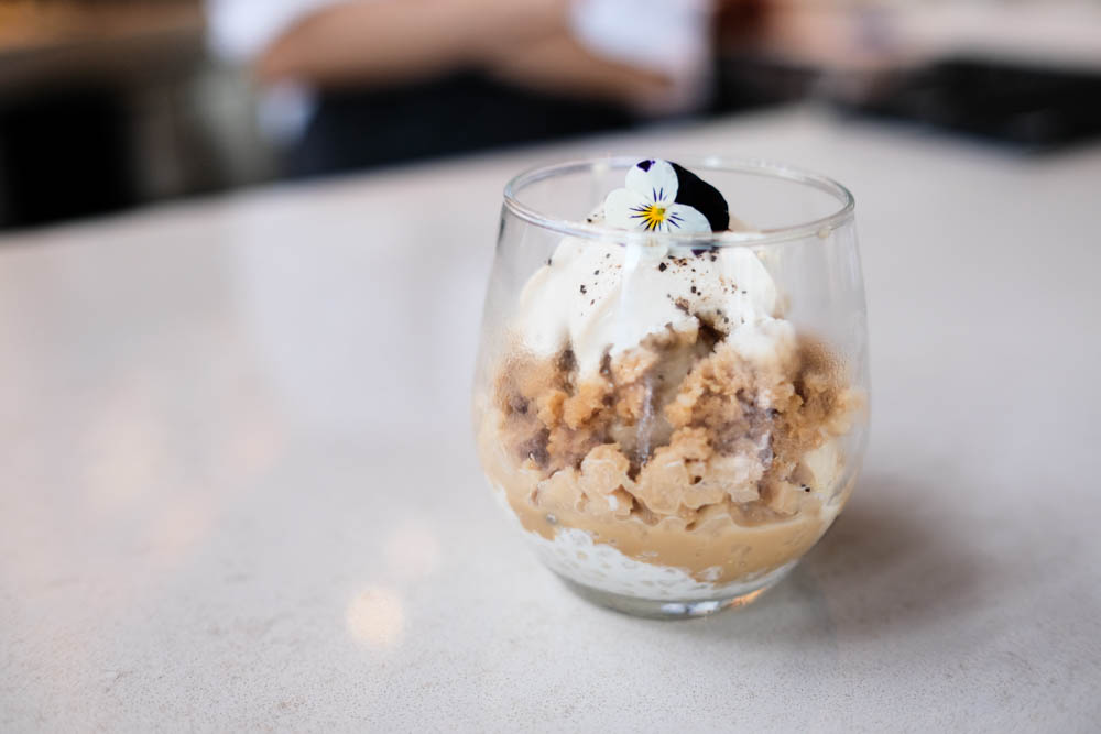 Michelle's Affo-misu, one of the featured desserts, starts with Hawaiian Vanilla formage blanc tapioca, coffee kanten and chocolate rice pearls layered with scoops of coffee gelato, shaved Vietnamese coffee ice topped with a Kahlua creme cloud and an edible viola flower.