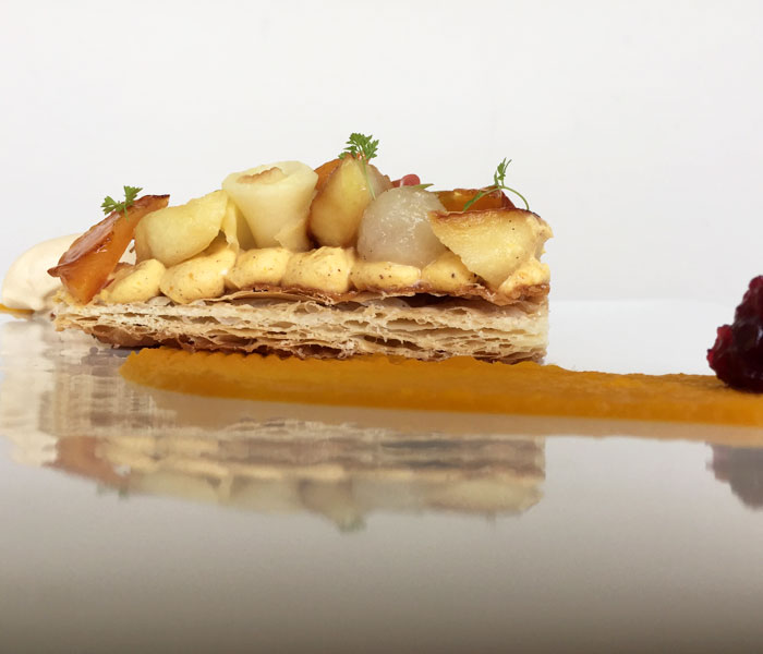 This puff pastry is topped off with kabocha cheesecake, candied Maui persimmons, white wine poached pears and Miso apples. It comes with a delicate scoop of dulce de leche ice cream.