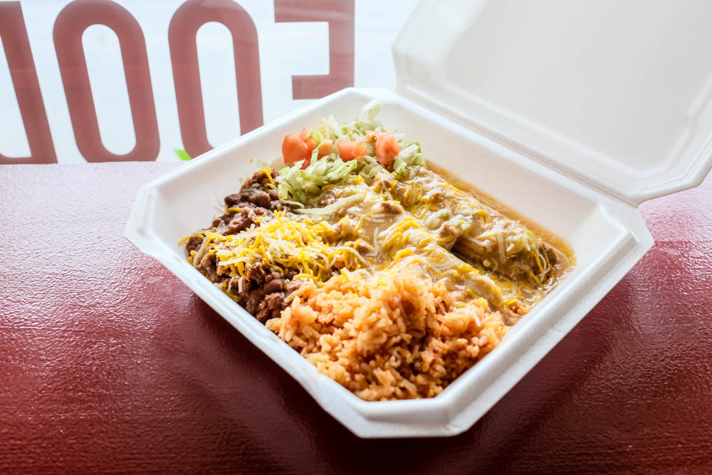 The two tamale plate ($10.50 is smothered in green chile sauce and includes rice, beans, shredded lettuce and diced tomatoes.