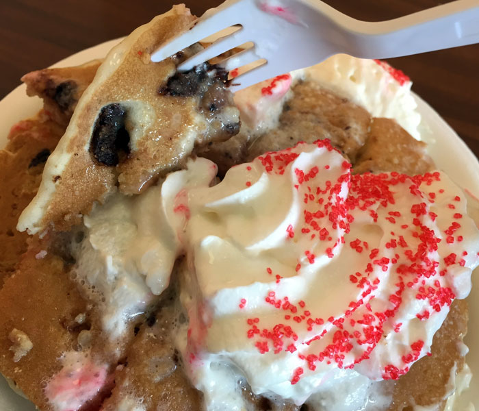 These pancakes are loaded with chocolate chip cookies, and there are even cookie crumbles on the top layer.