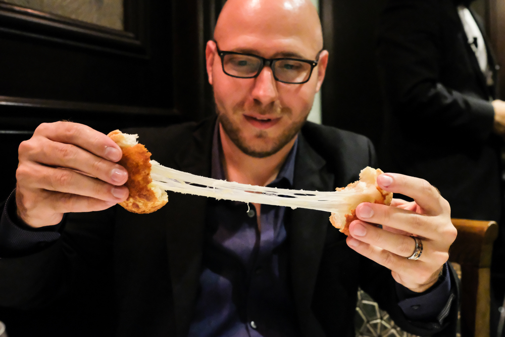 Billy giving us a droolworthy cheese-pull with Hy's new cheesy biscuits, a play on their classic cheese toast.