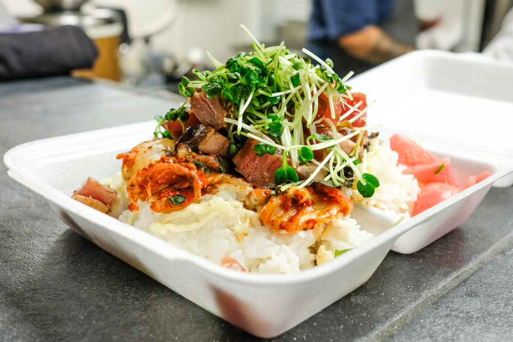 The kimchee ahi poke bowl is another towering creation with cubed ahi, wasabi aioli, and thick pieces of napa cabbage kimchee.