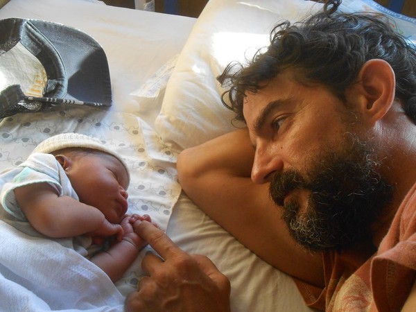 kevin and his newborn son, Miller. kevin and his newborn son, Miller.