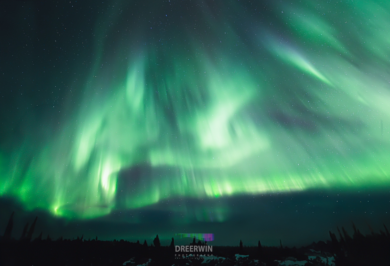 Azure Aurora: Mesmerizing Colors of Pinehouse Lake, Saskatchewan