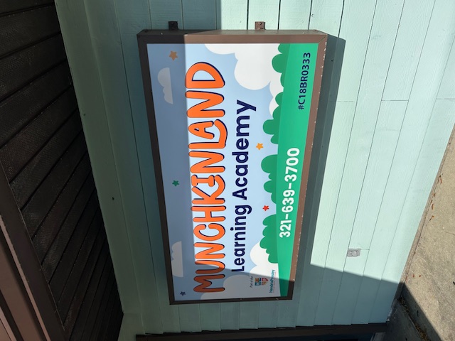 Munchkinland Learning Academy And Child Care Center Logo
