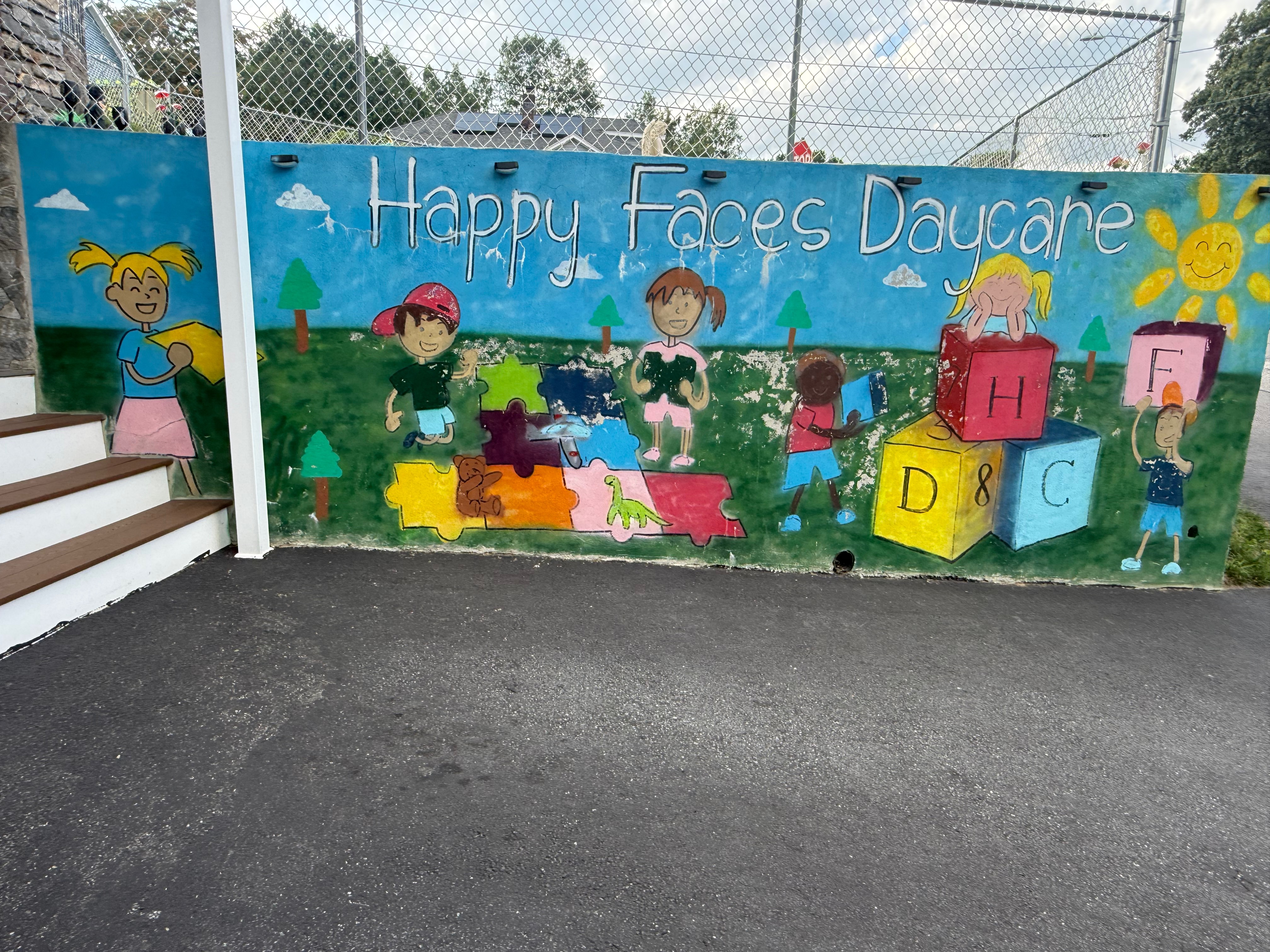 Happy Faces Daycare Logo