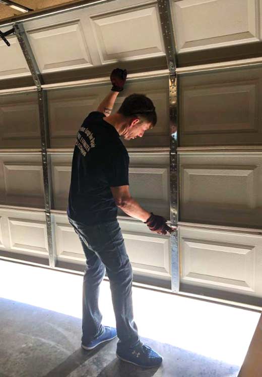 How can I improve the lifespan of my garage door?