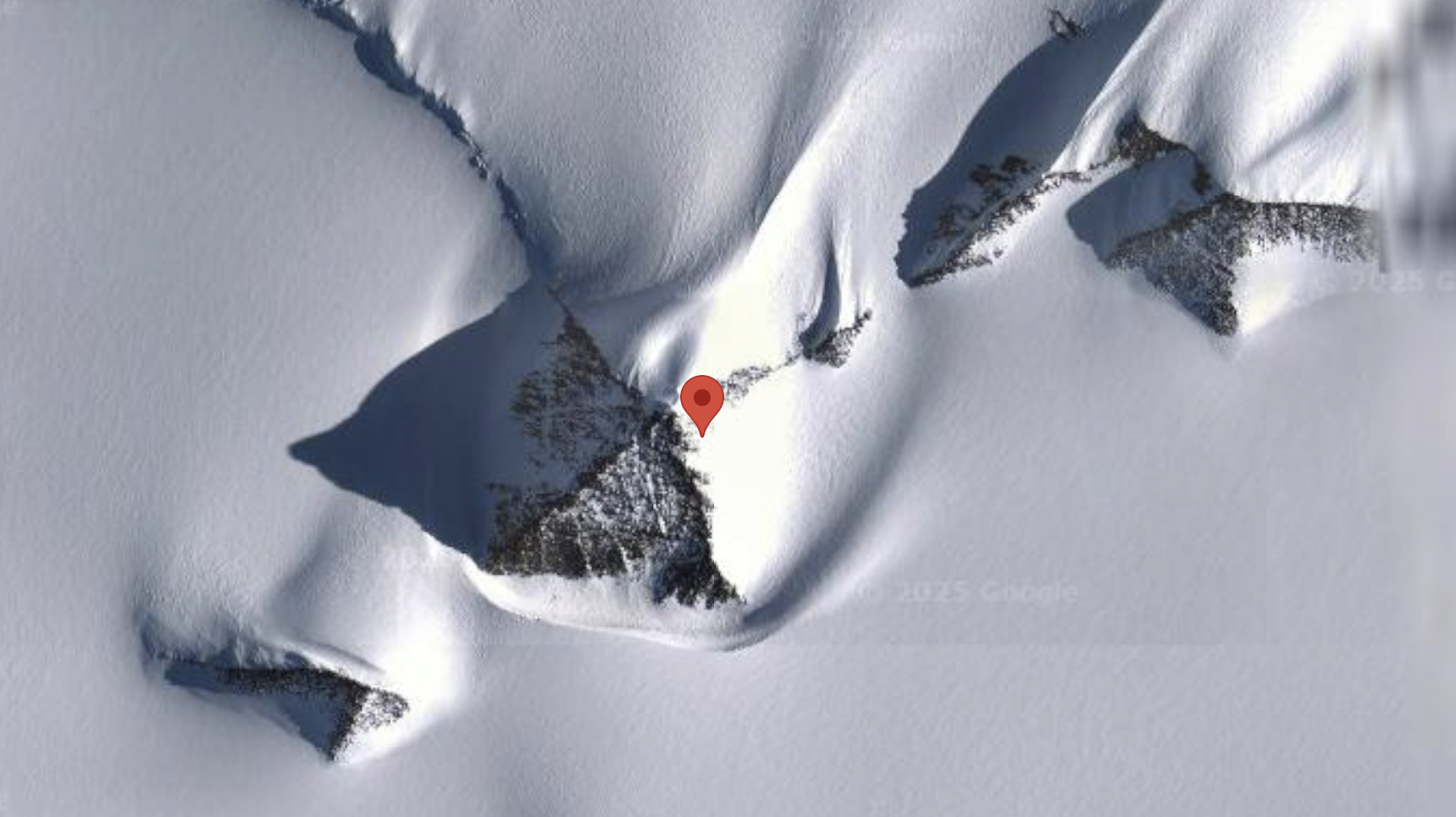 Pyramidal Antarctic Peak Spurs Geological Debate on Formation