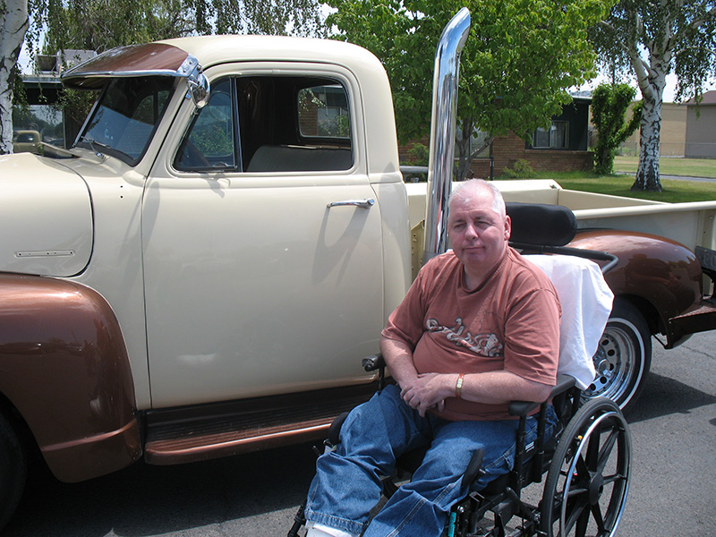 man sitting at truck
