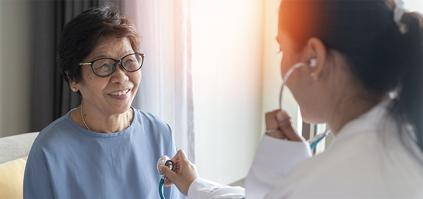 A doctor with a smiling patient.