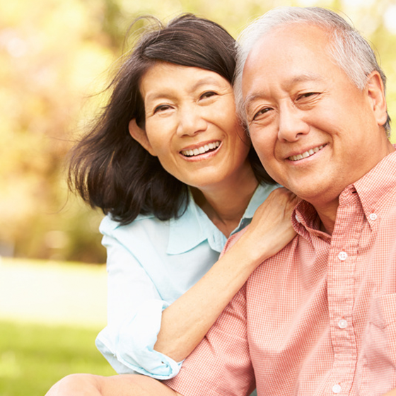 couple smiling in the park