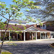 outside of a building with nice plants surrounding