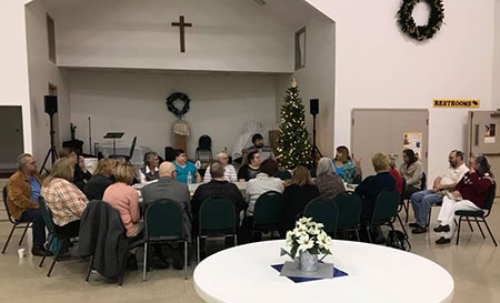 People gather for their new member class.