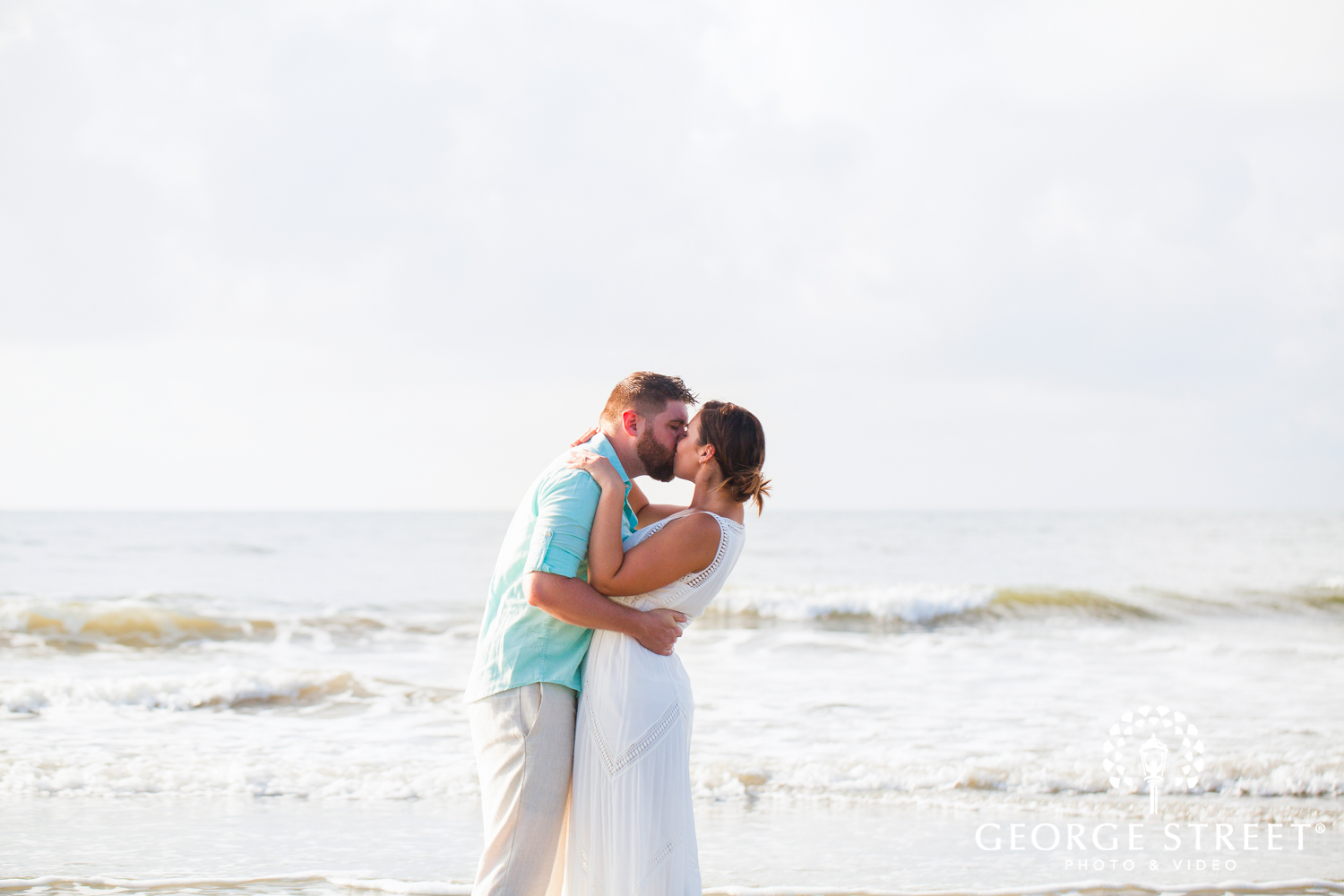 airy beach engagement photos